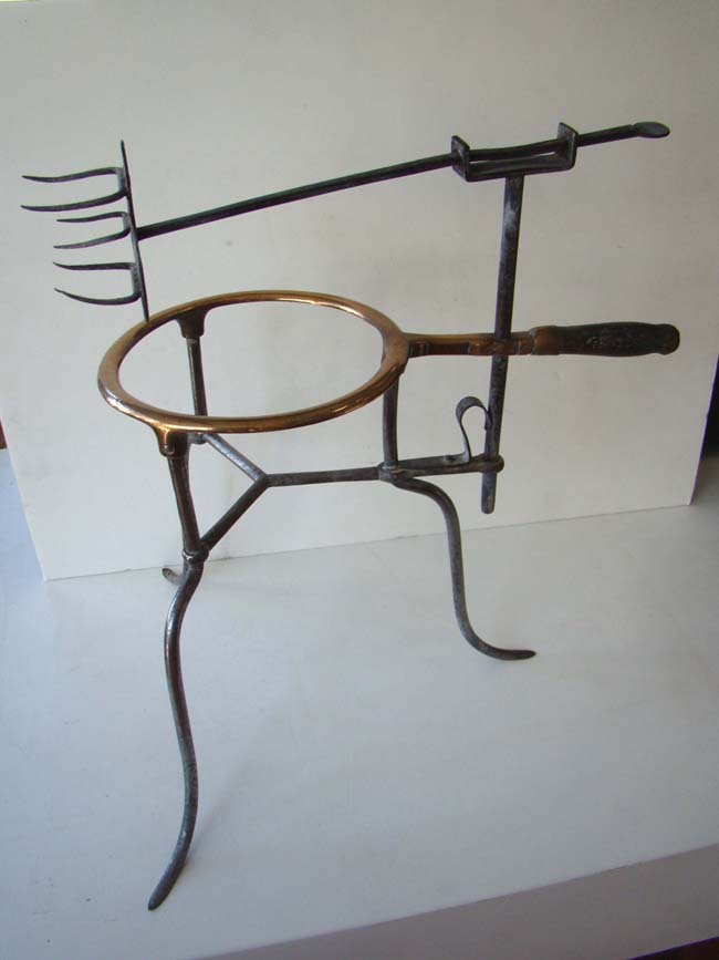An 18th century iron and brass "Game Spit" used for cooking game birds over an open fire